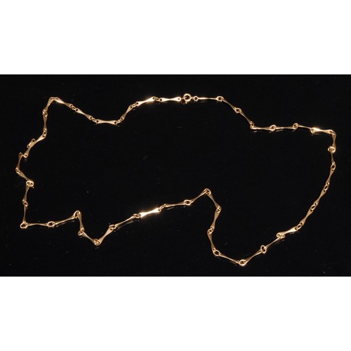 1408 - A long bit link necklace, stamped '750' for 18ct gold, 93cm long, approximately 30g