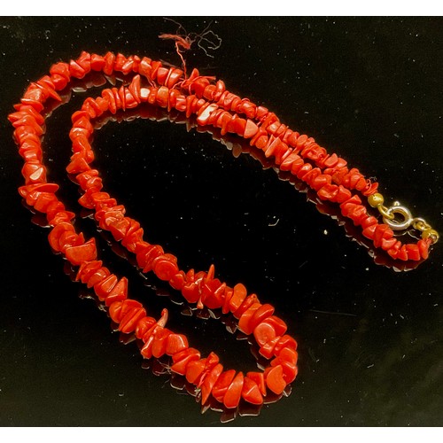 1415 - A orange branch coral necklace, 59cm long; three orange rough cut coral necklaces, each approximatel... 