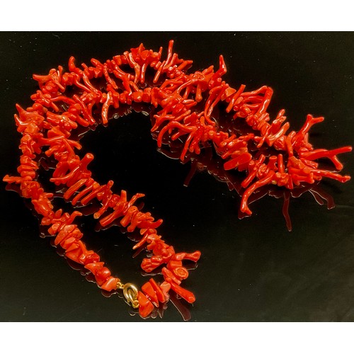 1415 - A orange branch coral necklace, 59cm long; three orange rough cut coral necklaces, each approximatel... 