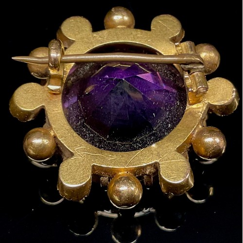 1407 - A late Victorian amethyst, diamond and seen pearl brooch, the large facet cut circular amethyst with... 