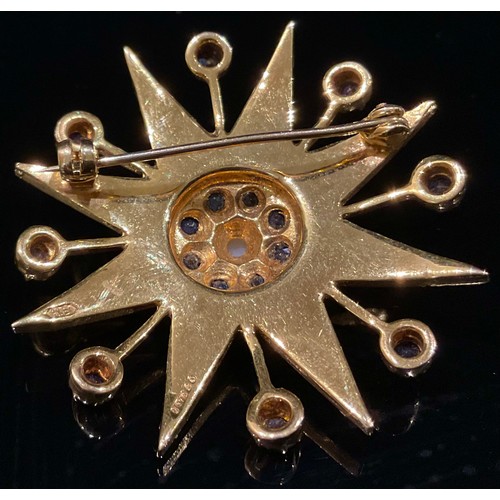 1442 - A sapphire, seed peal and 9ct gold eight pointed star brooch, each point set with graduated seed pea... 