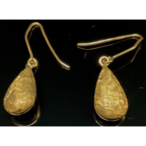 1528 - Eight pairs of 9ct gold earrings, including two pairs of double knot, a pair of conical banded drop ... 