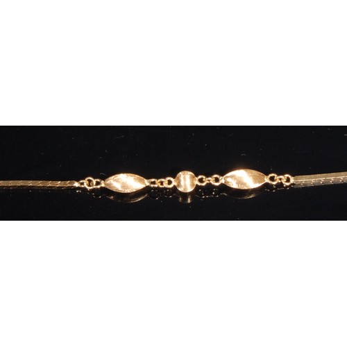 1409 - A long Saturn/station link necklace, stamped '750' for 18ct gold, divided by ball and dart satin bea... 