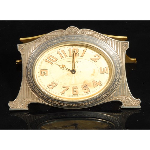 2414 - An Asprey & Co Limited easel travelling timepiece, 6cm oval engine turned dial with radium Arabic nu... 