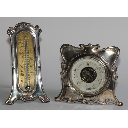 1164 - An Edwardian silver easel desk thermometer, scroll border, 15.5cm high, London 1906; an Art Nouveau ... 