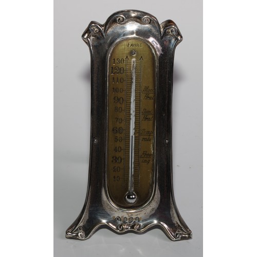 1164 - An Edwardian silver easel desk thermometer, scroll border, 15.5cm high, London 1906; an Art Nouveau ... 