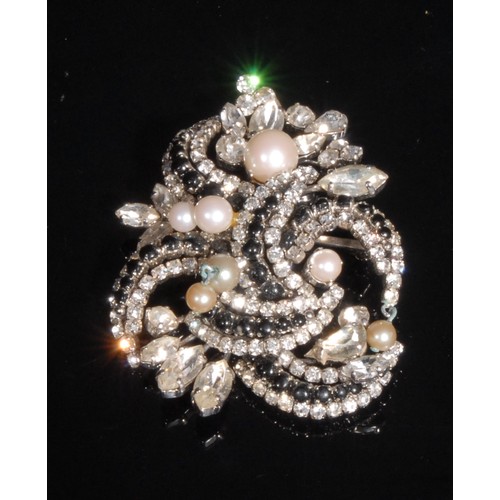 1526 - Bijoux Christian Dior, a simulated pearl and paste brooch, dated 1962, boxed; another similar, boxed... 