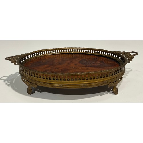 2634 - An Adam Revival gilt metal and burr walnut oval galleried tray, of small proportions, two laurel wre... 