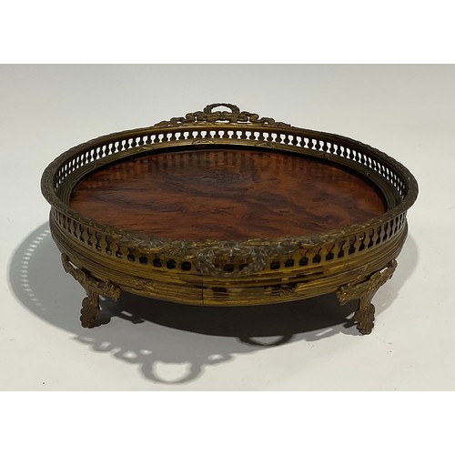 2634 - An Adam Revival gilt metal and burr walnut oval galleried tray, of small proportions, two laurel wre... 