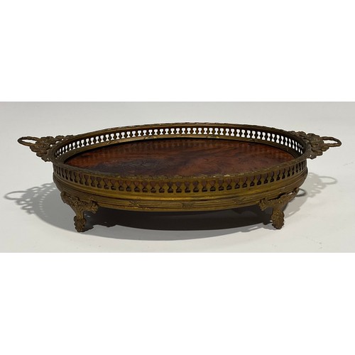 2634 - An Adam Revival gilt metal and burr walnut oval galleried tray, of small proportions, two laurel wre... 