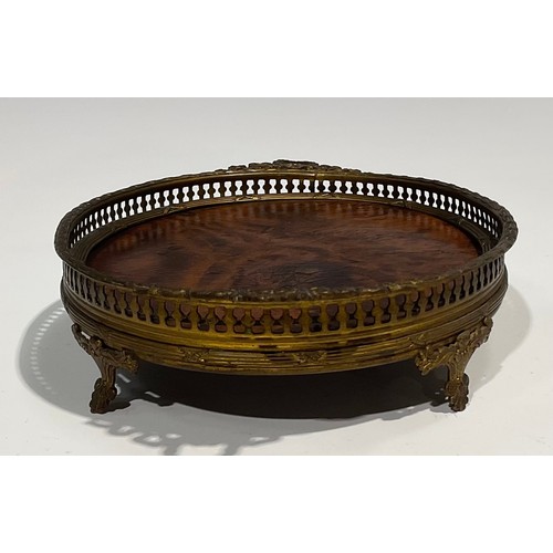 2634 - An Adam Revival gilt metal and burr walnut oval galleried tray, of small proportions, two laurel wre... 