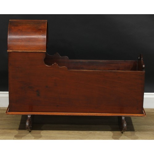 1951 - A late Victorian mahogany canopy top rocking cradle, 74cm high, 93.5cm long, 64.5cm wide, c.1890