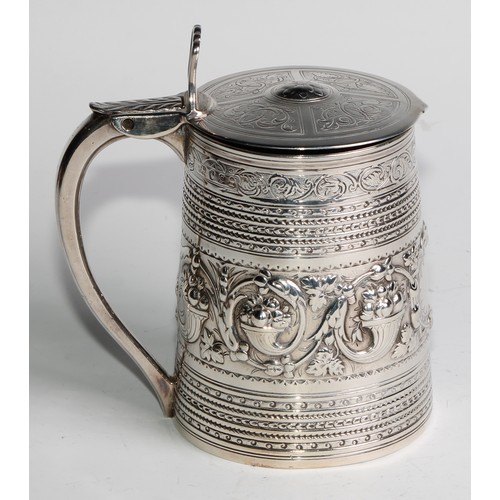 940 - A George III silver spreading cylindrical tankard, hinged slightly domed cover, open-work thumbpiece... 