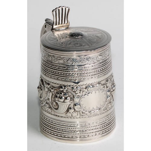 940 - A George III silver spreading cylindrical tankard, hinged slightly domed cover, open-work thumbpiece... 