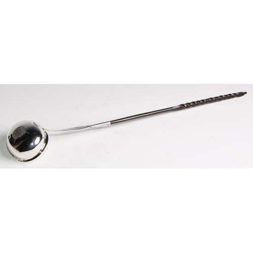 941 - A George III silver toddy ladle, inset with coin, twisted baleen handle, 39cm long, London 1788; a G... 