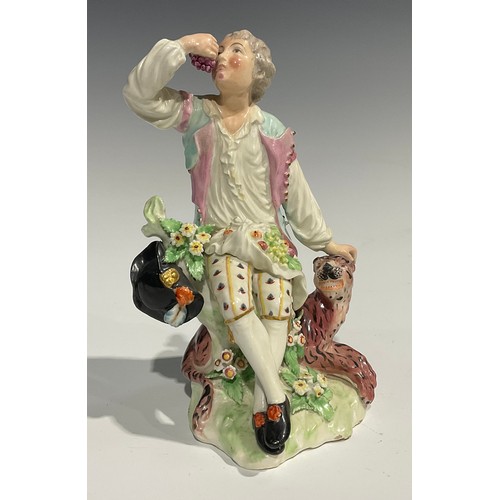 256 - An 18th century Derby patchmark figure, gentleman reclined eating grapes from a corn-u-copia, restin... 