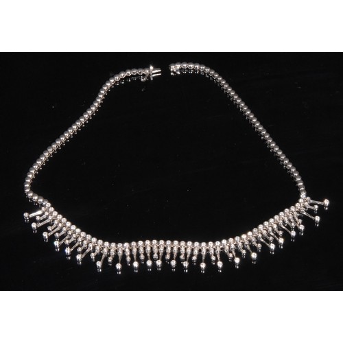 1491 - An 18ct white gold diamond droplet choker necklace, the necklet as a strand of polished spheres, app... 