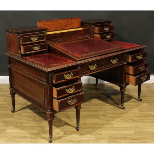 1955 - A late Victorian mahogany twin pedestal Dickens desk, shaped superstructure with hinged covered comp... 