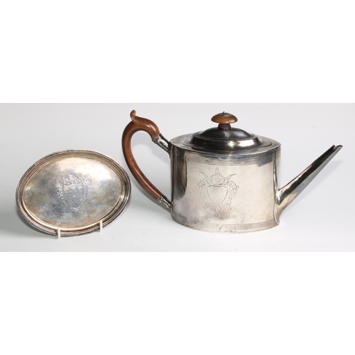 931 - A George III silver oval drum shaped teapot, bright-cut and wrigglework engraved with bands and vaca... 