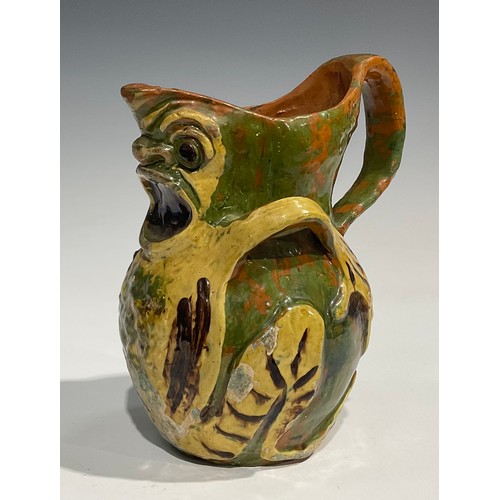 93 - A late 19th century terracotta grotesque jug, by Blanche Vulliamy, modelled as an amphibious style c... 