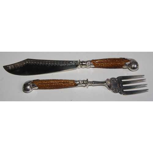 793 - A pair of late Victorian silver country house fish servers, pierced and wriggle-work engraved blades... 