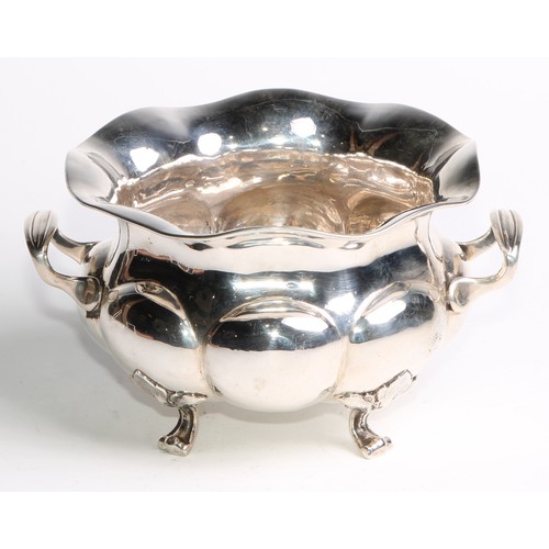 1049 - A Russian silver lobed circular two-handled bowl, scroll feet with stiff leaf bosses, 18cm wide, Mos... 