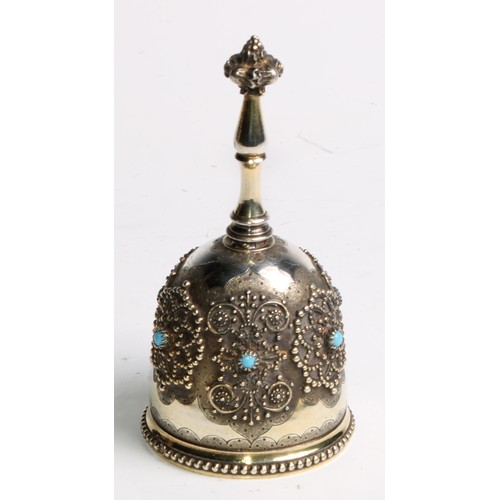 852 - A 19th century French Renaissance Revival silver-gilt table bell, applied with medallions and set wi... 