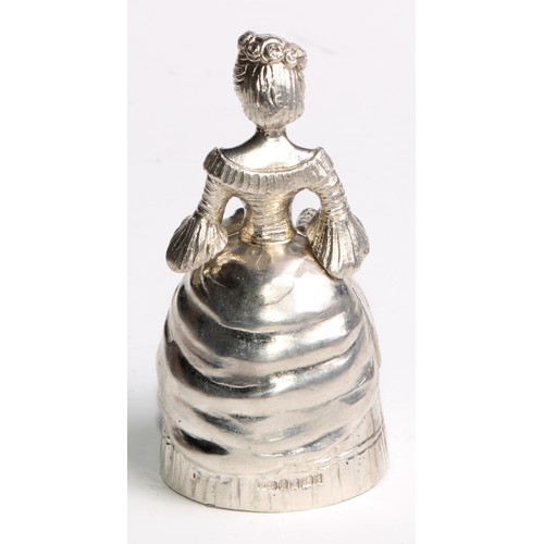 880 - A Continental silver novelty table bell, cast as a lady of title, elegantly dressed and holding a fa... 