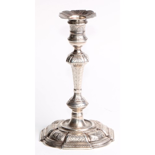 892 - A George II cast silver taper or candlestick, knopped pillar, chased overall with flowers and stiff ... 