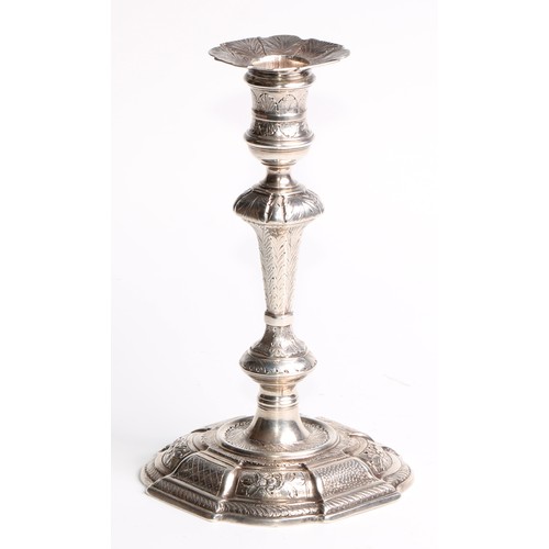 892 - A George II cast silver taper or candlestick, knopped pillar, chased overall with flowers and stiff ... 