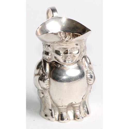 963 - A George V silver novelty cream pitcher, as a toby jug, modelled after a Staffordshire pottery model... 