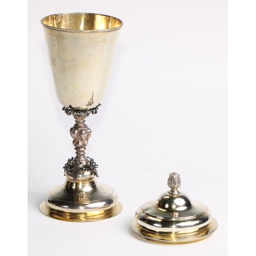 1120 - An 18th century Russian silver-gilt pedestal cup and cover, acanthus bud finial, lobed knop, domed f... 