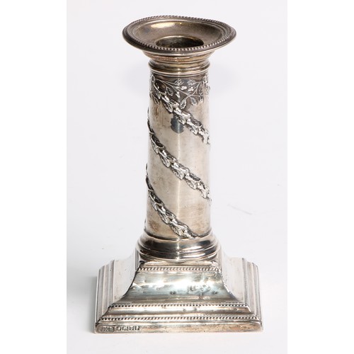 1034 - A pair of Victorian silver columnar candlesticks, in the Neo-Classical taste, beaded borders, steppe... 