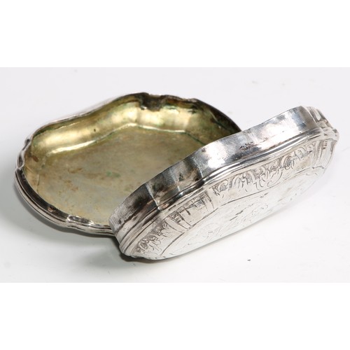 1116 - An 18th century Continental silver bombe shaped snuff box, hinged cover chased with a narrative scen... 