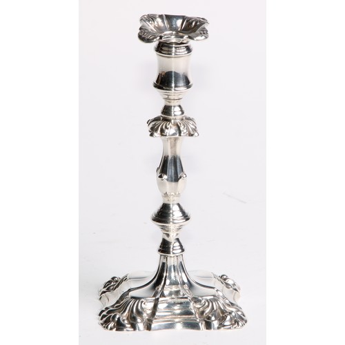 1039 - A pair of William IV silver tapersticks, detachable nozzles, knopped pillars, fluted square bases, s... 