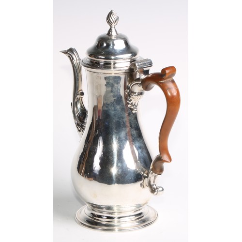 1149 - An early George III silver baluster pedestal coffee pot, hinged domed cover with spiral knop finial,... 