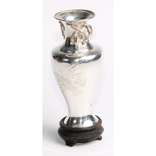 861 - A Chinese silver baluster vase, engraved with a bird of prey on a prunus branch, to verso with a vac... 