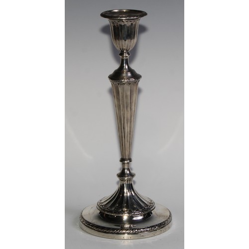 1038 - A pair of Victorian silver table candlesticks, in the Adam Revival taste, urnular sconces with detac... 