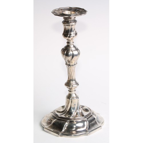 1055 - A set of four George II silver table candlesticks, wrythen pillars, piecrust nozzles and bases, 26.5... 