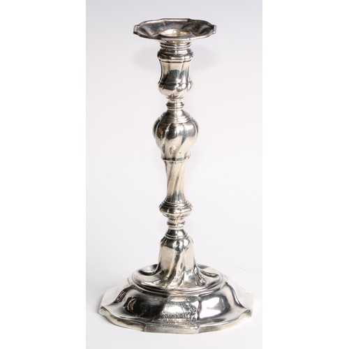 1055 - A set of four George II silver table candlesticks, wrythen pillars, piecrust nozzles and bases, 26.5... 