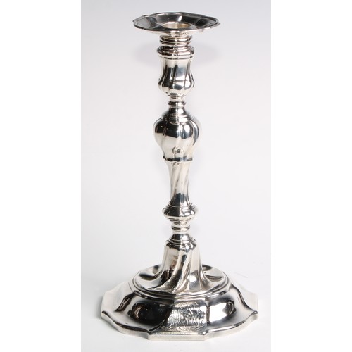 1055 - A set of four George II silver table candlesticks, wrythen pillars, piecrust nozzles and bases, 26.5... 