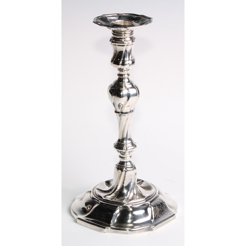 1055 - A set of four George II silver table candlesticks, wrythen pillars, piecrust nozzles and bases, 26.5... 