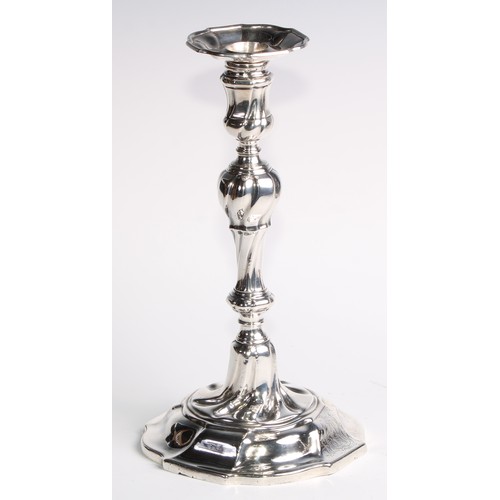 1055 - A set of four George II silver table candlesticks, wrythen pillars, piecrust nozzles and bases, 26.5... 