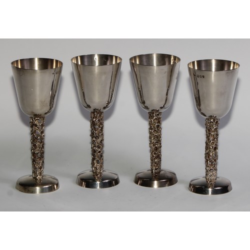 1210 - Graham Watling (Bn.1930) - a set of four Elizabeth II silver wine goblets, plain bell shaped bowls, ... 