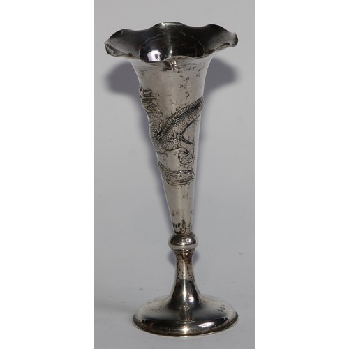 1013 - A pair of Chinese silver trumpet shaped specimen vases, chased with dragons, domed bases, 15cm high,... 