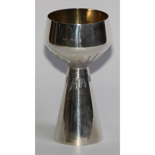 1211 - Grant Macdonald - an Elizabeth II silver pedestal goblet, gilt bowl, splash-textured grip, conical b... 