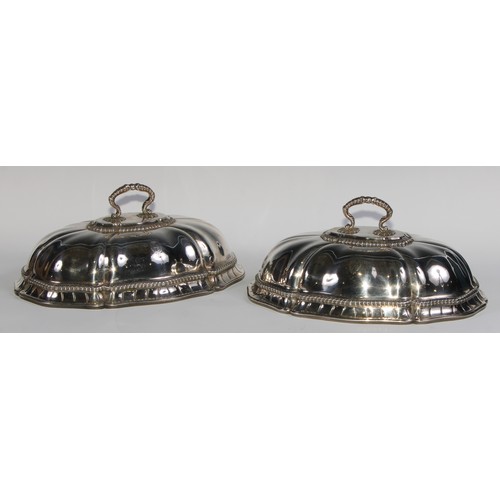 1228 - Royal Household Silver - a pair of George III silver fluted domed meat dish covers, engraved with th... 