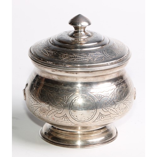 853 - A 19th century Russian silver circular pedestal tea caddy, chased and wrigglework engraved with flow... 