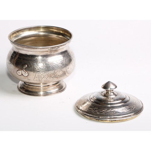 853 - A 19th century Russian silver circular pedestal tea caddy, chased and wrigglework engraved with flow... 