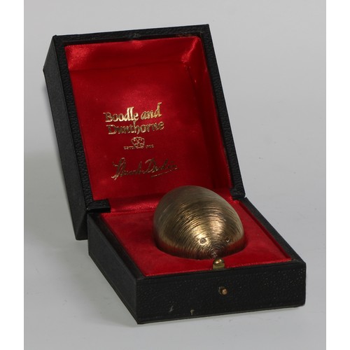 1254 - Stuart Devlin (1931 - 2018) - an Elizabeth II silver-gilt Surprise Egg, Humpty Dumpty, textured over... 